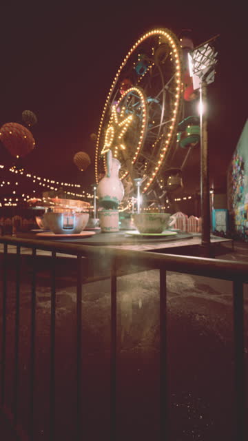 Illuminated Ferris Wheel in Abandoned Nighttime Amusement Park