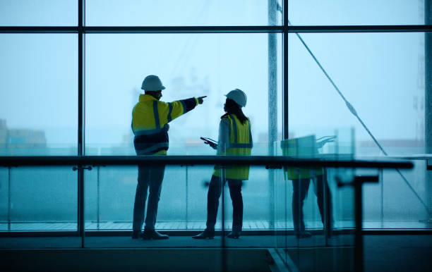 Civil engineering and brainstorming with building project, people and cooperation with renovation. Meeting, staff and industrial with support and architecture with safety, development and inspection