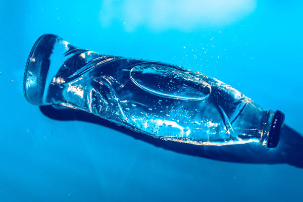 istock Water bottle close up on dark blue background 2148856325