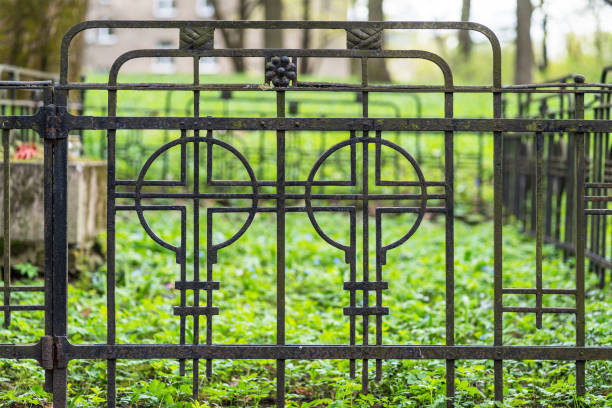 Close-up of an old cemetery fence