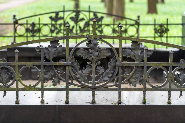 Close-up of an old cemetery fence