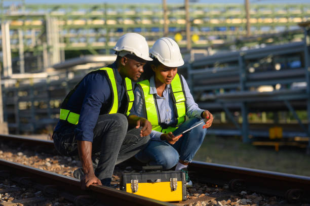 istock Male and female engineers check the drawing system inspection with the real pipe system of the new construction project, engine engineer, Sysetm cooling machine, compared to drawing design. 2148856910