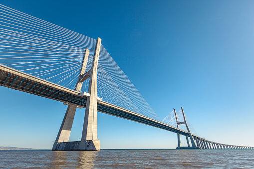 The Ponte Vasco da Gama is a bridge with a cable-stayed bridge as the main opening that spans the Tagus River and connects Lisbon by motorway from Moscavide/Sacavém to the southeast and southern cities of Montijo, Alcochete and Setúbal.