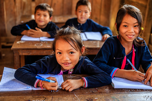 Laotian children, wearing traditional Lantan tribe clothes, during classes in a primary school in Lantan village in Northern Laos