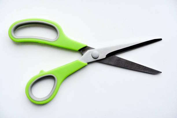 istock Sewing scissors on a white background. Green scissors. 2148859361
