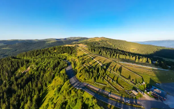 Aerial view of Weinebene mountain range and scenic road in Styria, Austria