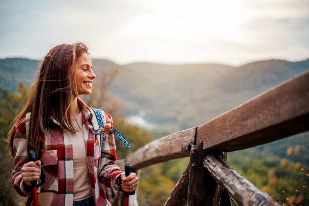 istock Happy woman with a backpack spending a day in nature, a portrait. 2148861936