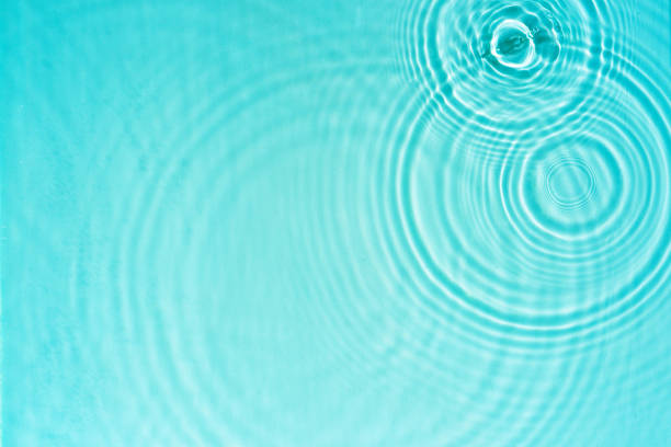 istock Circles and waves on blue water in sunlight 2148862122