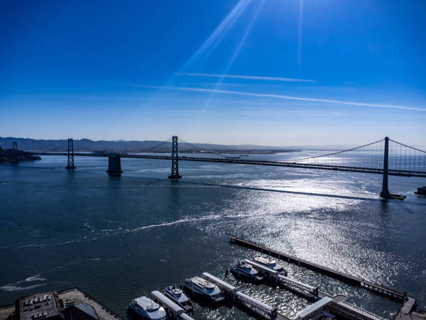 San Francisco, California, April 8, 2024. The Bay Bridge spans the waters of San Francisco Bay with a clear blue sky overhead.