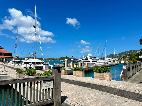 Bright and colorful harbor view with yachts and boats in the marina of Marigot in Saint Martin, French side of the Caribbean Island.