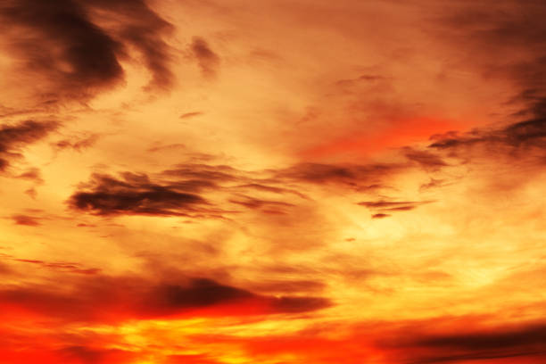 Background of a beautiful bright orange sunset with cirrus clouds