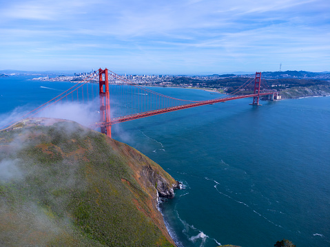 Aerial view of Golden Gate Bridge, San Francisco, from North side, with small fog, during day of springtime