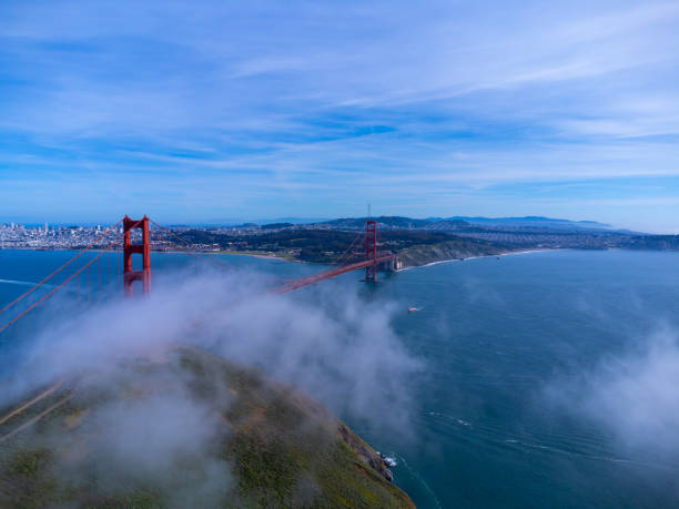 Aerial view of Golden Gate Bridge, San Francisco, from North side, with small fog, during day of springtime