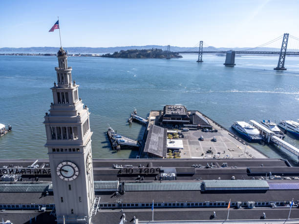 Aerial view of San Francisco ferry building during springtime day with the bay in background