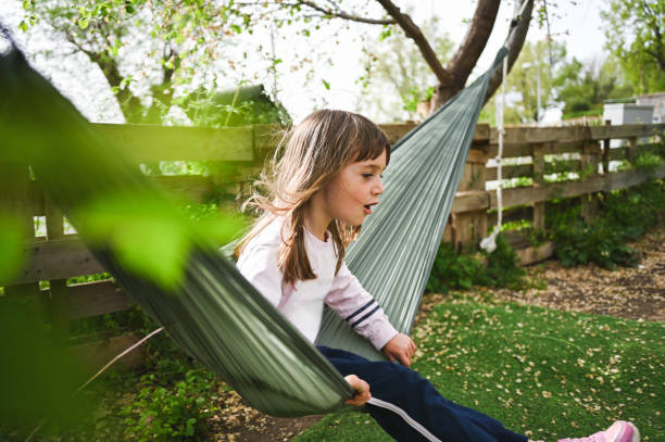 istock Candid child relaxing in back yard. 2148864276