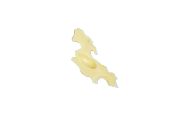 istock slice of Gruyere cheese isolated on white background 2148864397