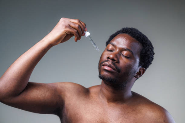 istock Man applying a face serum - skin care concept 2148865272