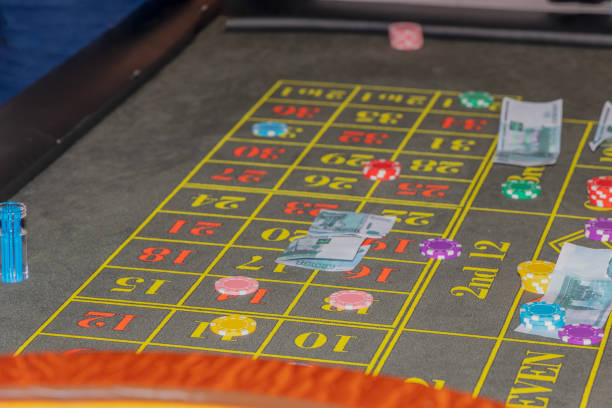 istock gambling bets: chips and paper money 2148867772