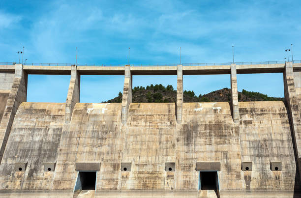 istock Front bottom view of a dry concrete river dam 2148867897