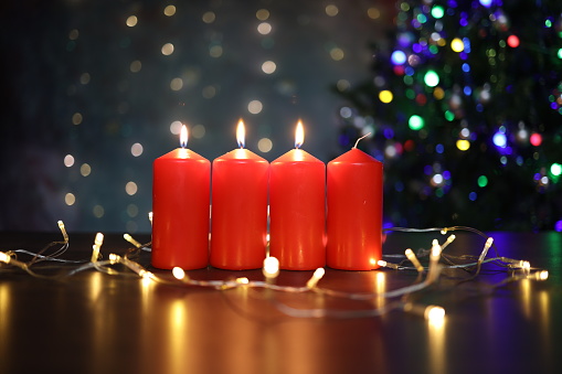 Advent Season, four candles burning. Advent background.