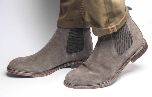 istock Man in suede Chelsea boots on a white background 2148868655