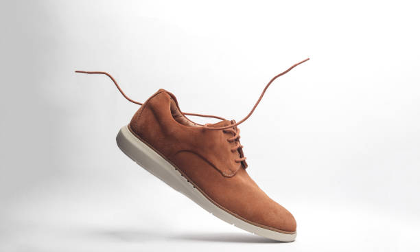 istock Suede shoes with flying laces on a white background 2148868684