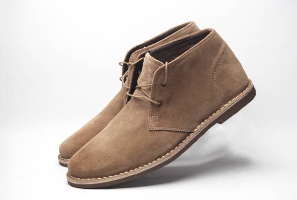 istock Suede desert shoes floating on a white background 2148868699