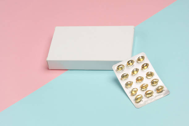 istock White Box of pills on blue pink background 2148868717