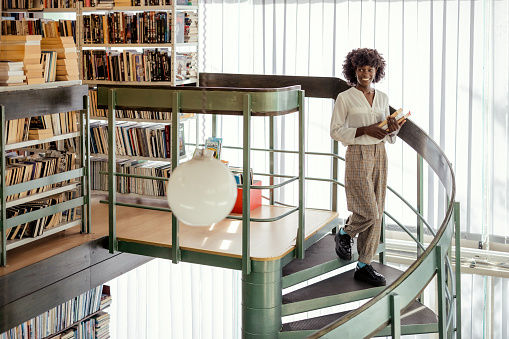 Academic Concept. Smiling African American Female College Student in Campus Library