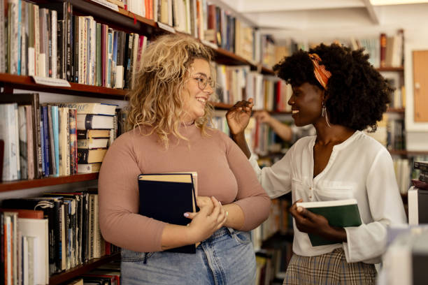 istock University students and library friends 2148869633
