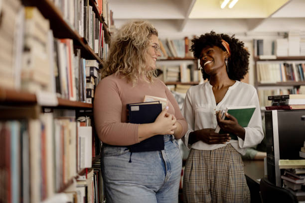 istock University students and library friends 2148869681