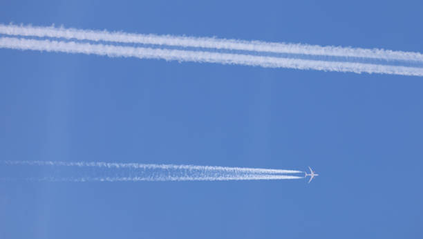 istock two double airplane tracks in the blue sky 2148870420