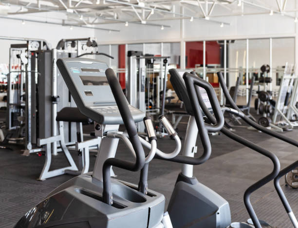 istock gym interior, modern machines treadmills and dumbbells 2148871461