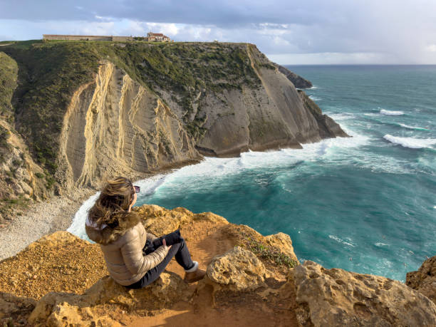 istock Woman on cliff in Sesimbra 2148872007