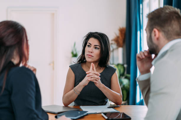 istock Group of business persons talking in the office. 2148872528