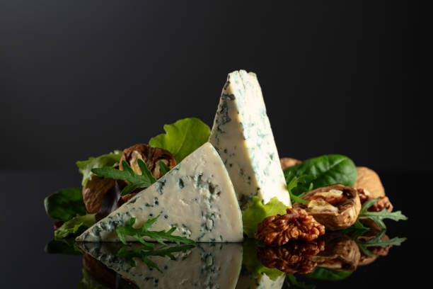 istock Blue cheese with walnuts and fresh greens. 2148872631