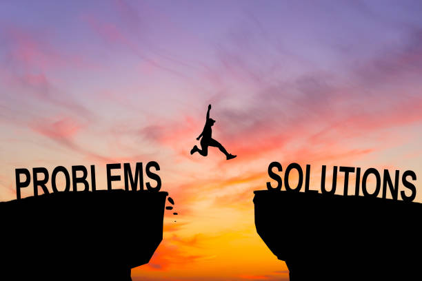 istock Silhouette businessman Jumping over problems message in sunset background. Business concept 2148872662