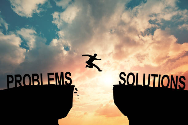 istock Silhouette businessman Jumping over problems message in sunset background. Business concept 2148872665