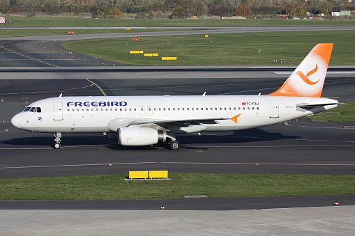 Dusseldorf, Germany - October 27, 2012: Turkish Freebird Airlines Airbus A320-200 with registration TC-FBJ on taxiway at Dusseldorf Airport