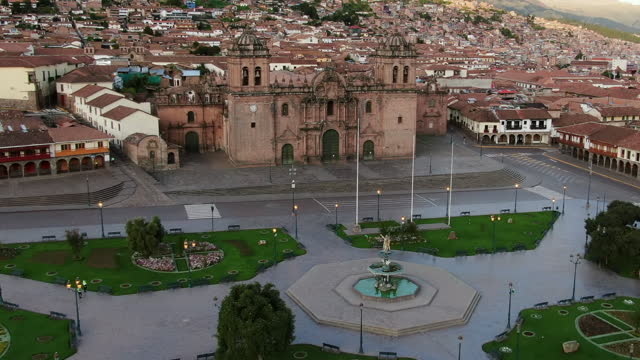 Plaza de Armas And The Church of the Society of Jesus In The Historic Center Of Cusco, Peru. - aerial shot