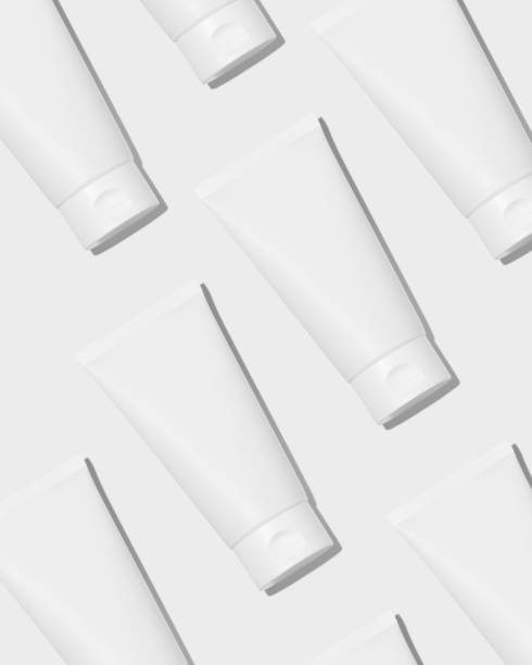 Empty white plastic tubes for cosmetics. Mockup. Packaging for cream, gel, serum. Cosmetic pattern