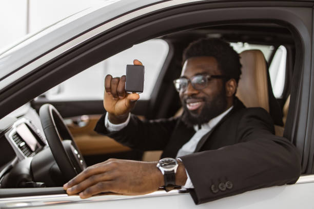 istock Selective focus on car keys of happy African man. 2148876453