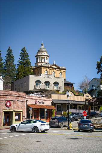 Auburn, CA, U.S.A. - March 25, 2024: Photo of the historic Auburn Courthouse building in the background, with part of the older downtown area in the foreground. The town dates back to the gold rush.