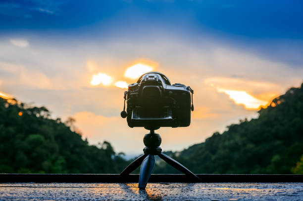 istock back dslr camera on mini tripod shooting sunset landscape 2148877610