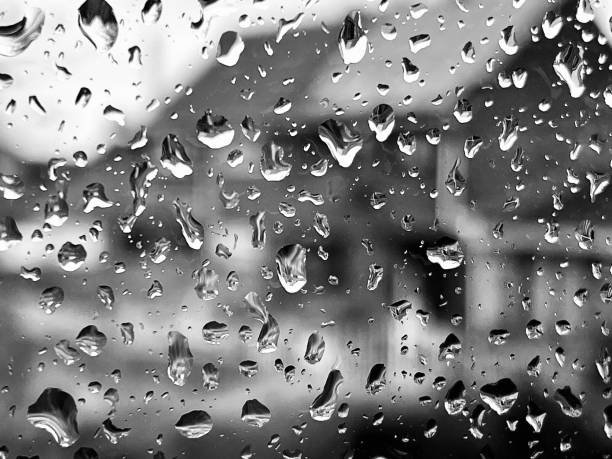 istock Close up of raindrops on a window 2148878014