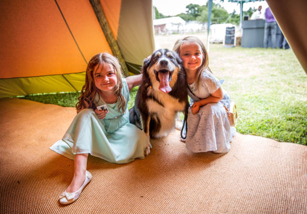 Two young cousins with dog on farm