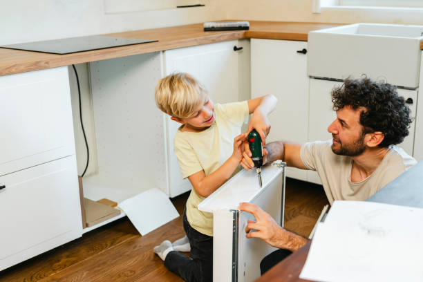 istock Father and son assembling kitchen furniture 2148879294