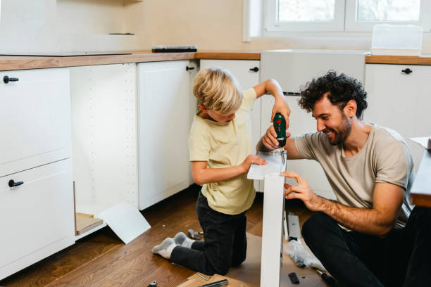 istock Father and son assembling kitchen furniture 2148879319