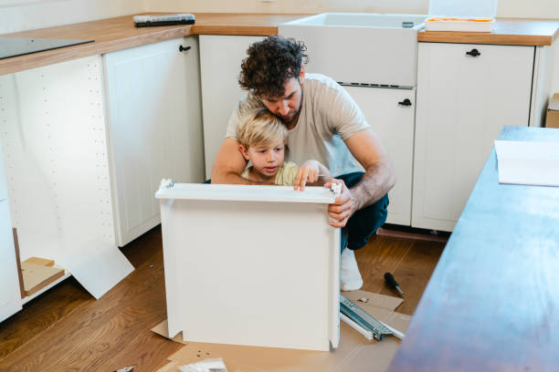 istock Father and son assembling kitchen furniture 2148879320