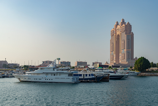 Abu Dhabi, United Arab Emirates - November 9, 2023: A picture of the Rixos Marina Abu Dhabi Hotel and the yachts at the Abu Dhabi Marina on the Abu Dhabi Breakwater.